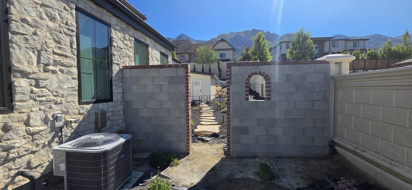 Before: gray block wall, ready for finish