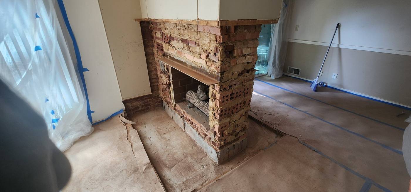 Before: old brick fireplace opened up for demo
