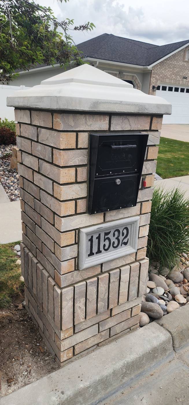 Brick mailbox pillar, angled view