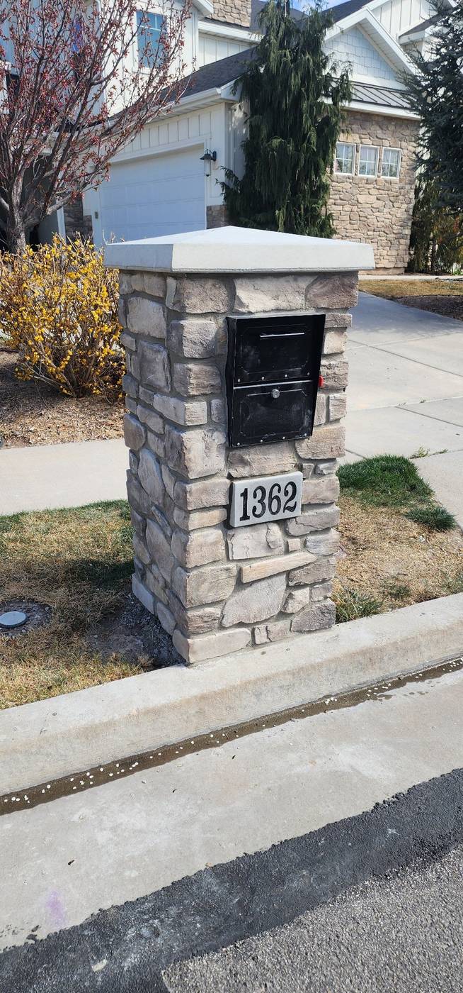 Stone mailbox pillar, angled view