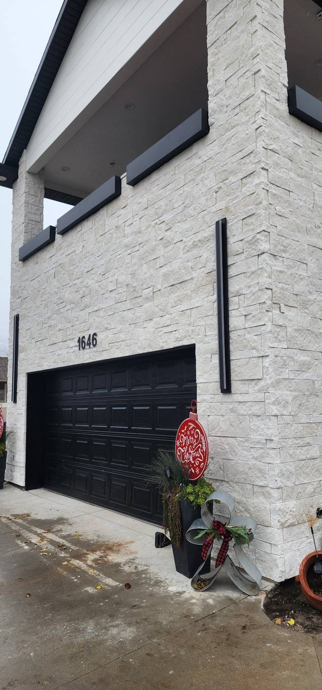 White stacked-stone veneer on the garage