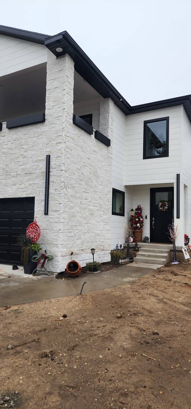 White stacked-stone veneer, front elevation