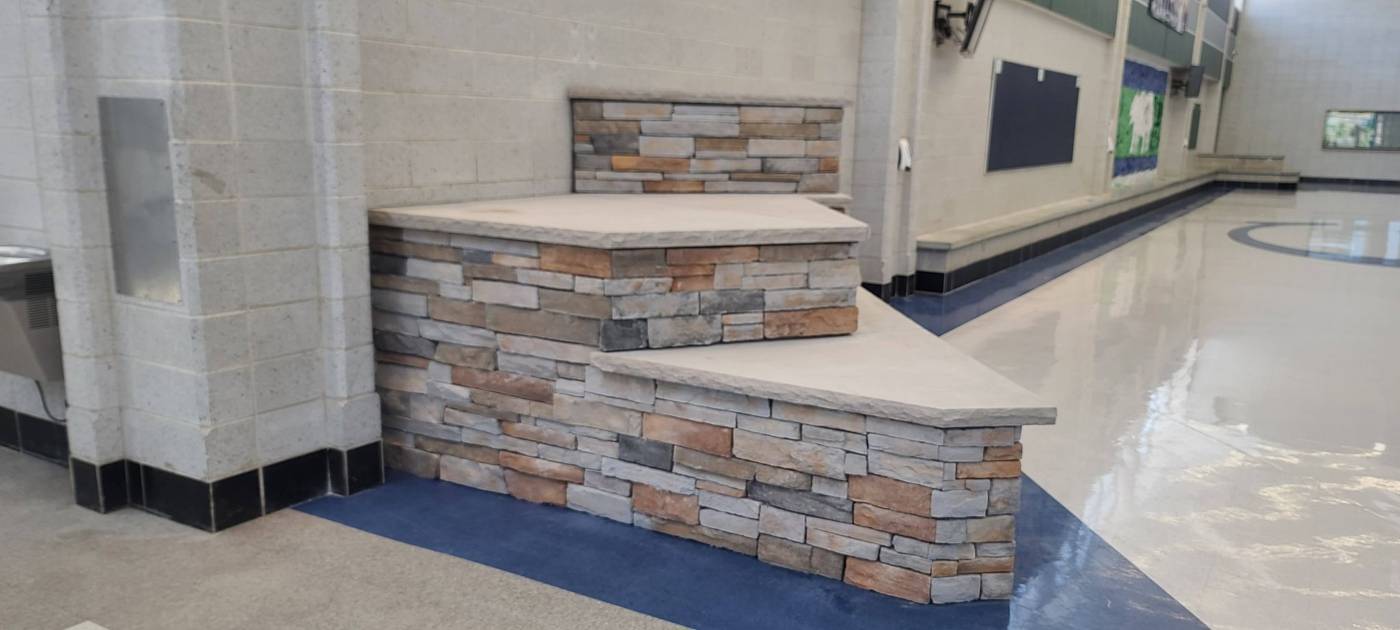Stone bench platform, school gym