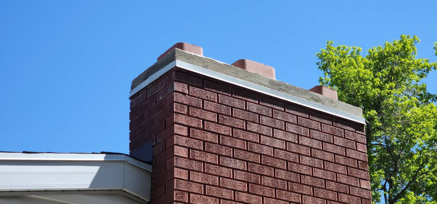 Brick chimney with new caps