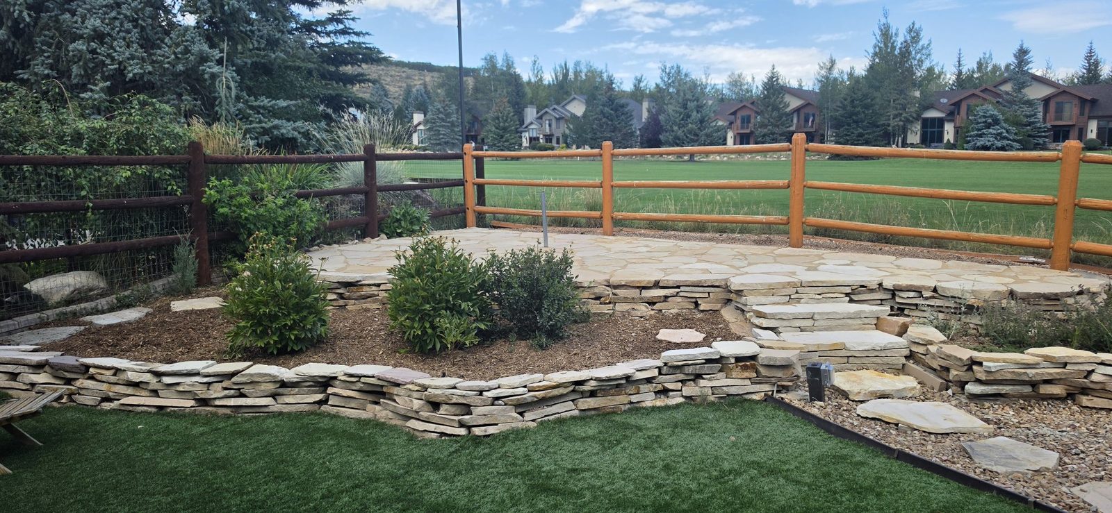 After: flagstone patio and planting beds, finished